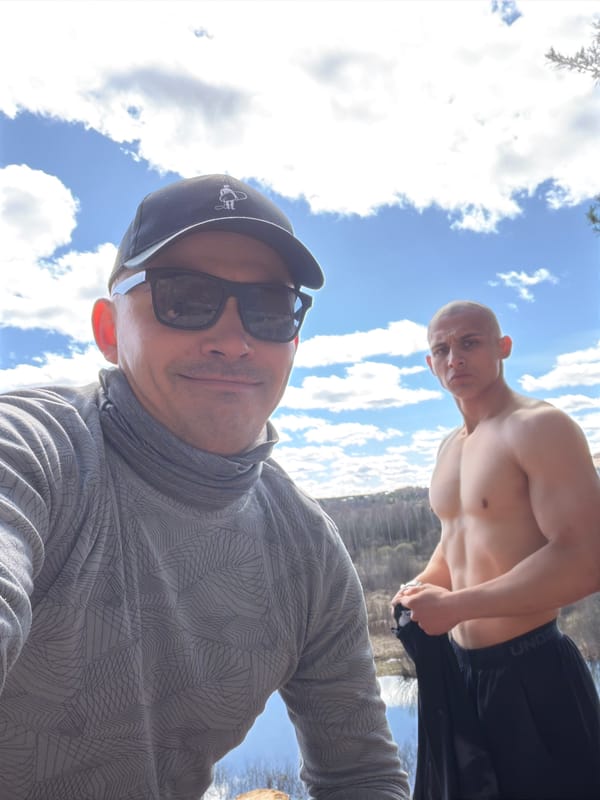 Two men take sunny day selfie in Izhevsk, Russia