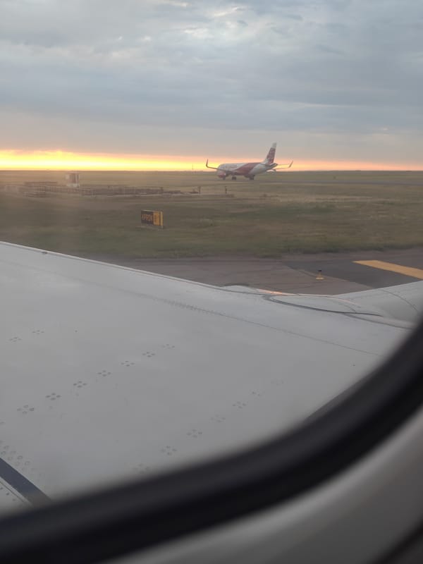 On the ground and airborne at Astana Airport around sunset