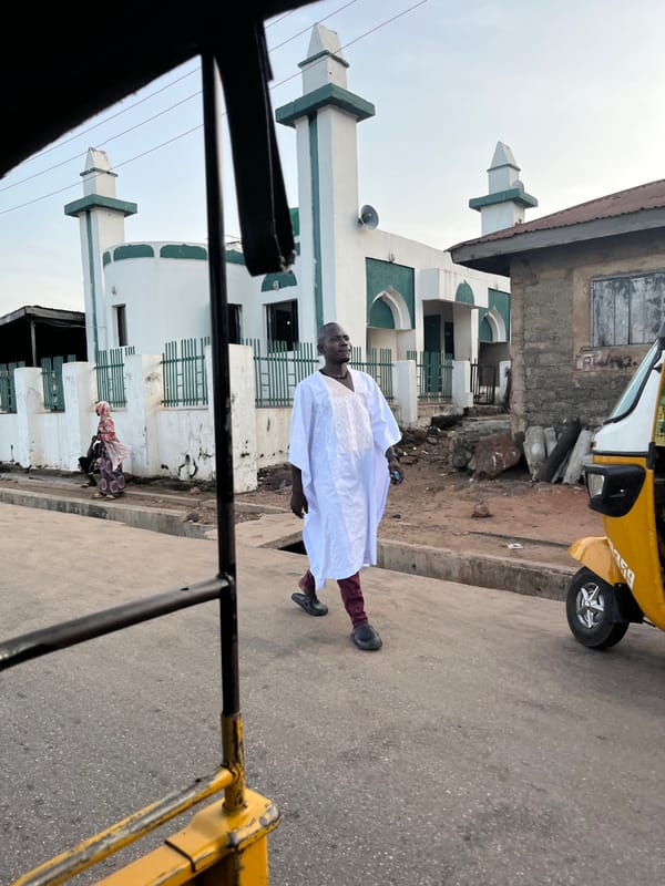 Street-level urban life in a West African city market district