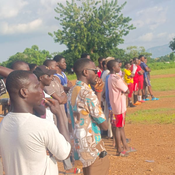 Outdoor gathering at a sports field in Akwanga, Nigeria