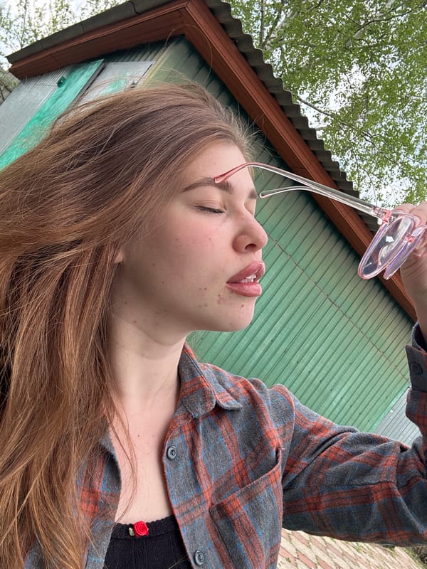 Woman documents spring afternoon in Russian village garden