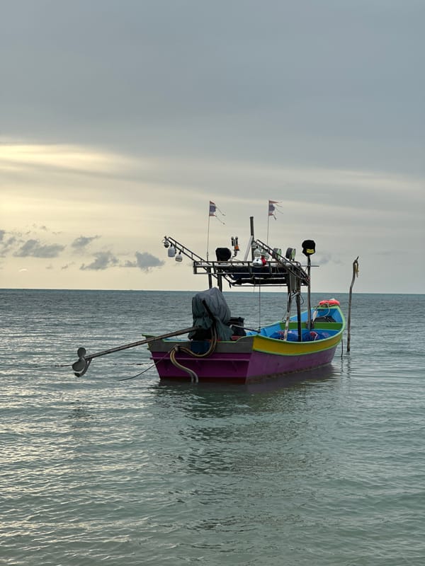 Quiet Ko Samui beach morning: boats, palms, and low tide