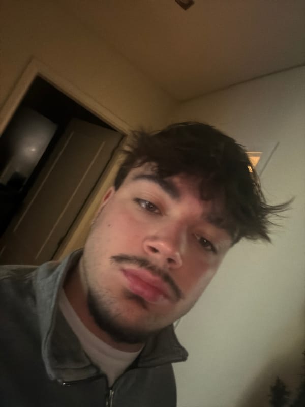 Young man takes indoor selfie in Vila Real, Portugal