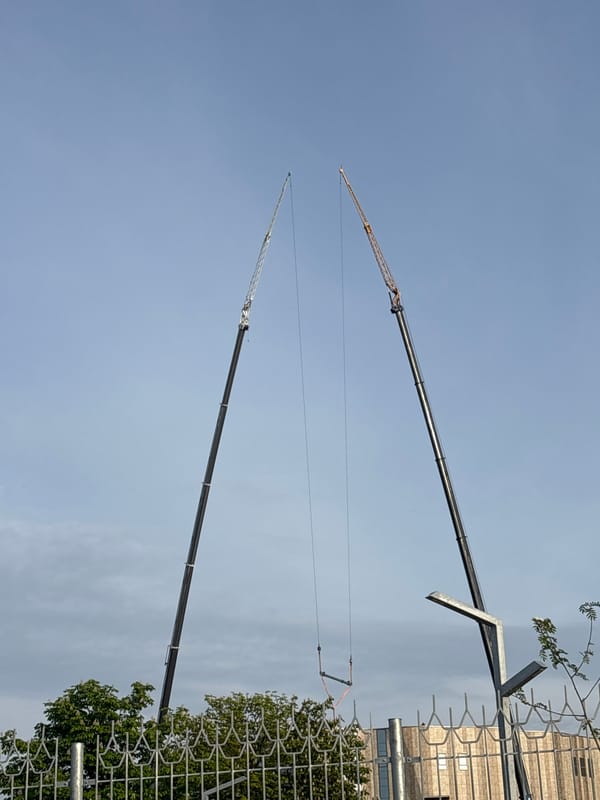 Construction cranes operate along Svislach River in central Minsk