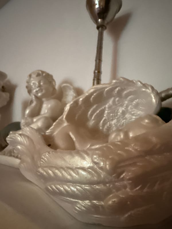 Home interior details: sleeping cats, figurines, and decorative objects