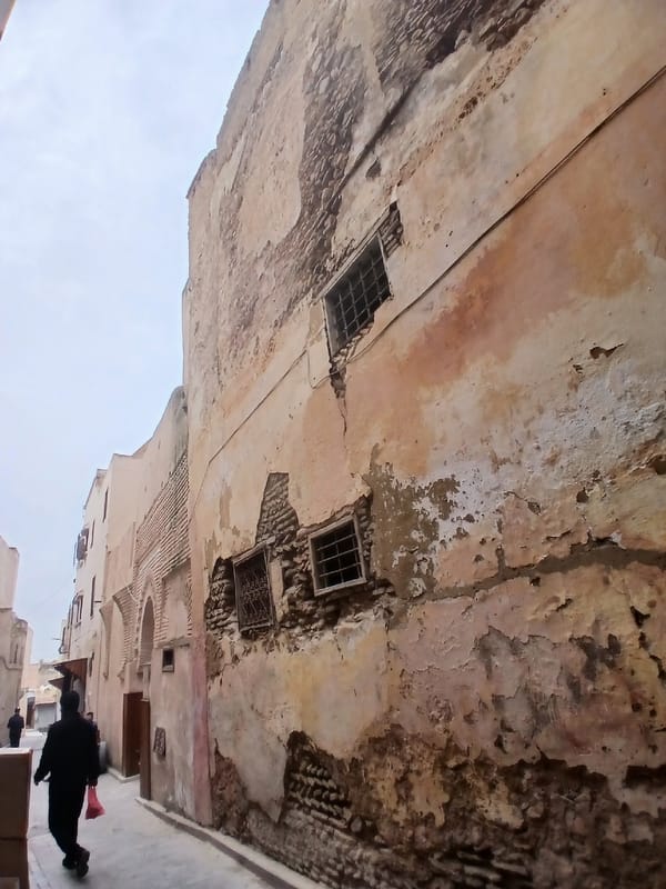 Weathered historic architecture documented in Meknes street scene