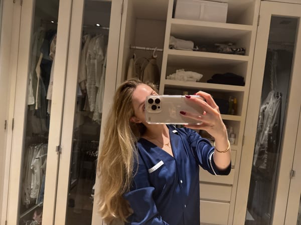 Person takes early morning selfie at home closet