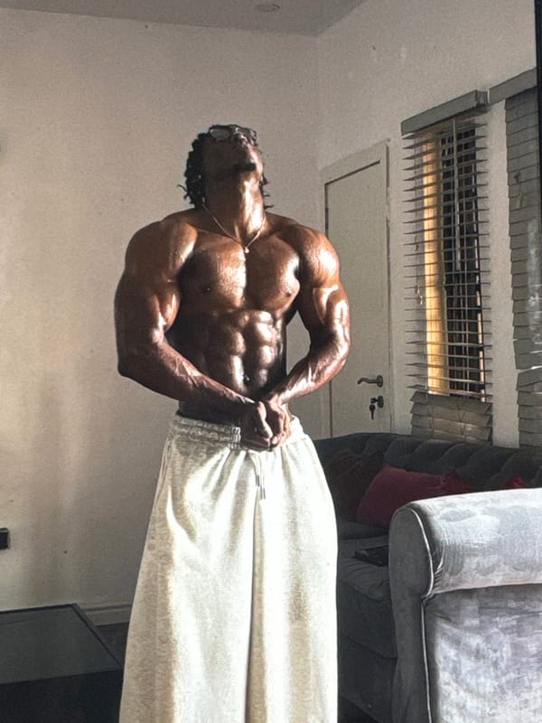 Man poses, flexes in mirror in Awka residence