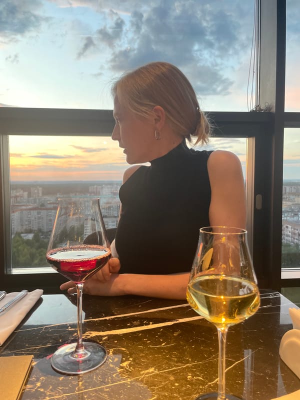 Dinner and drinks at a rooftop restaurant with city views