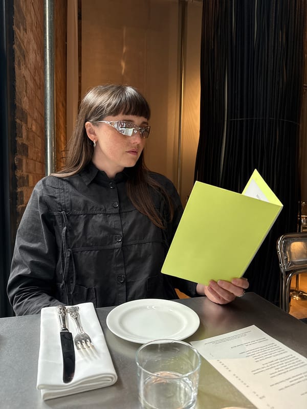 Diner reviews menus at London restaurant