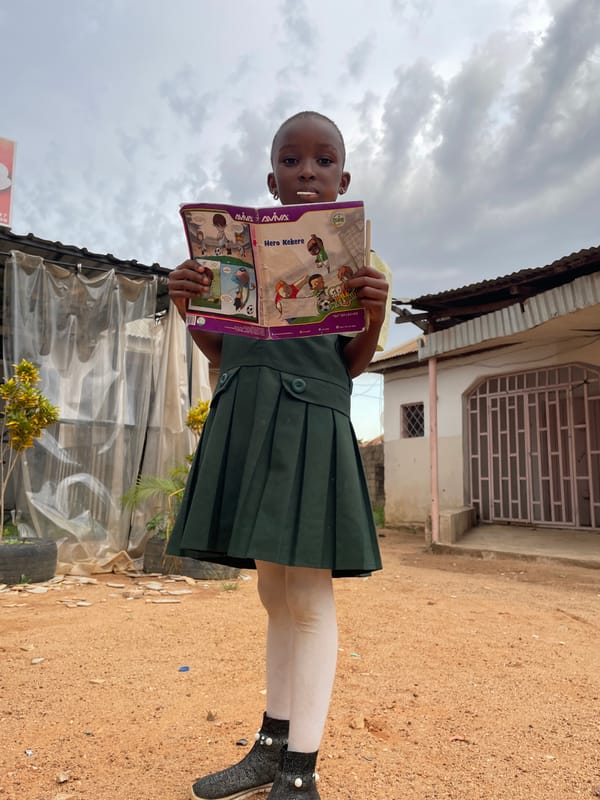 Daily life unfolds in Jos streets: schoolchildren, vendors, motorcycles