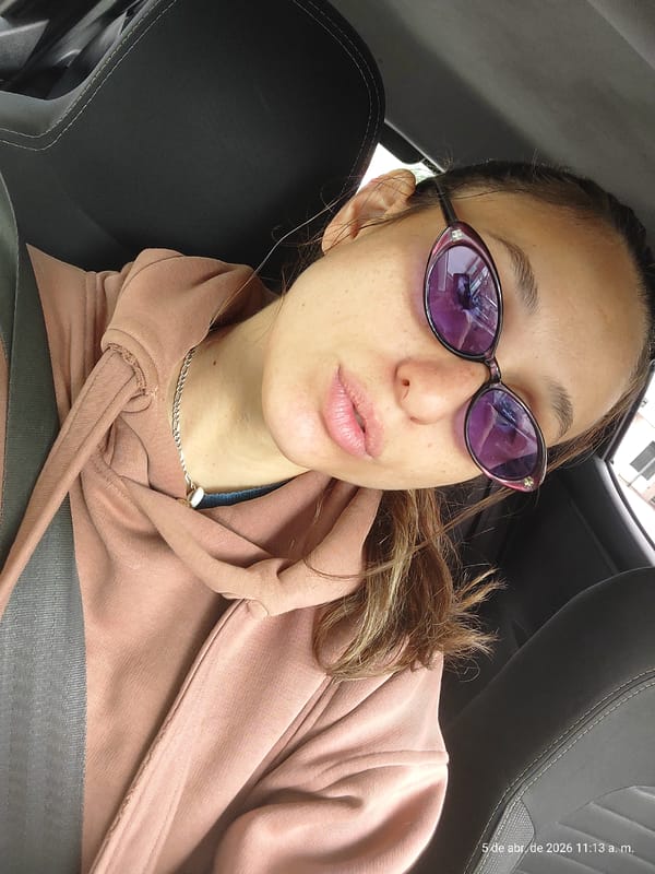 Woman in pink hoodie travels as car passenger in Buenos Aires