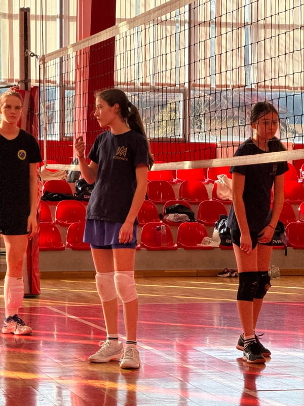 Volleyball team practices in Etropole gymnasium