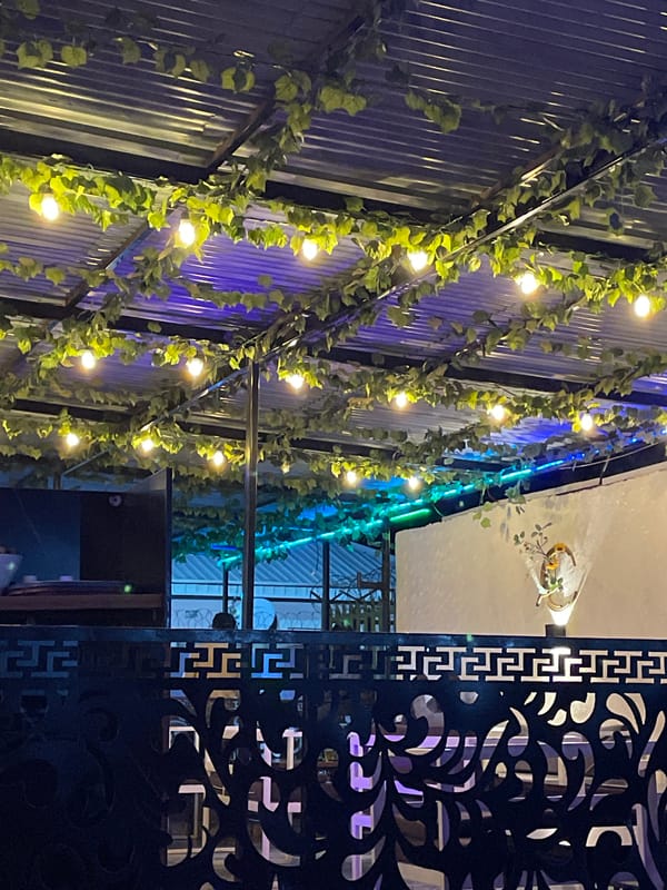 Evening dining captured at outdoor venue in Jos, Nigeria