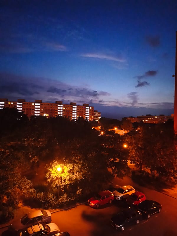 Dusk falls over Most's apartment blocks, with quiet moments inside