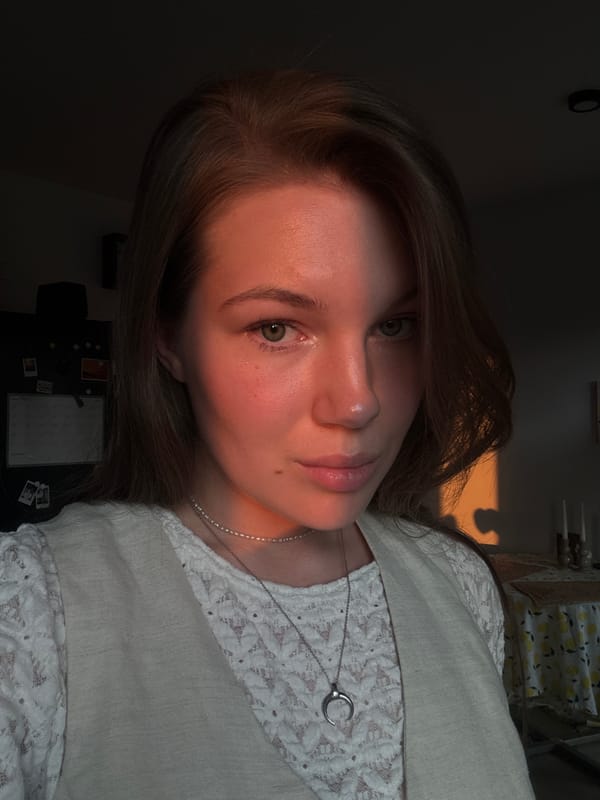 Woman photographed in sunlit indoor setting in Belgrade