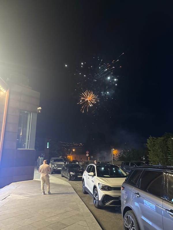 Fireworks and nightlife fill a Tbilisi summer evening