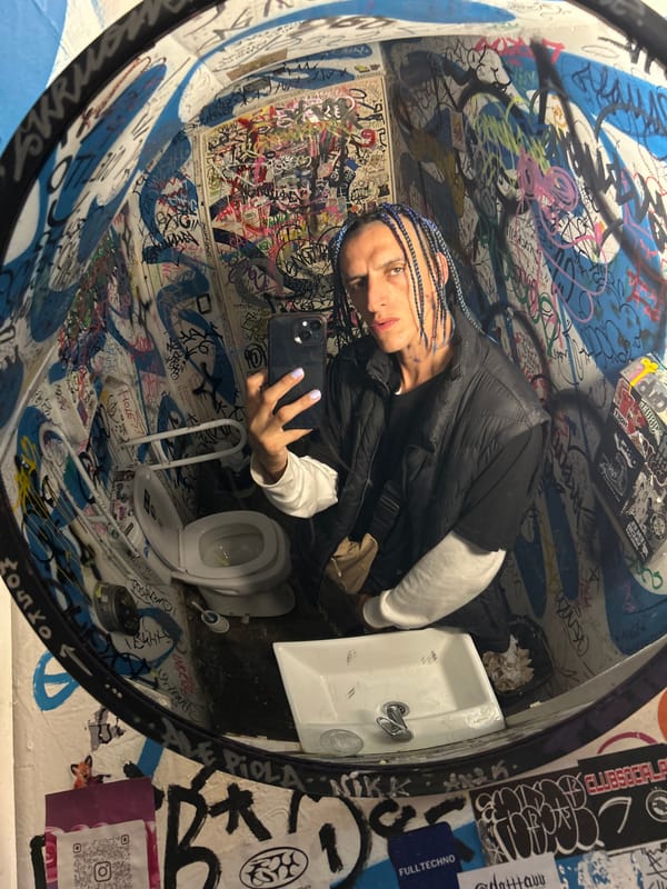 Late-night selfie session documented in Buenos Aires restroom