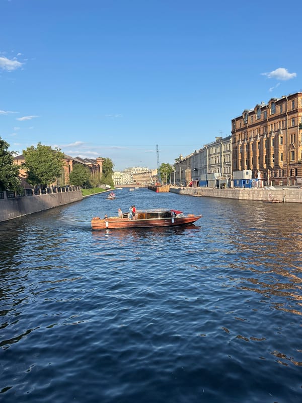 Boats, canals, and parkside moments along a historic European waterfront