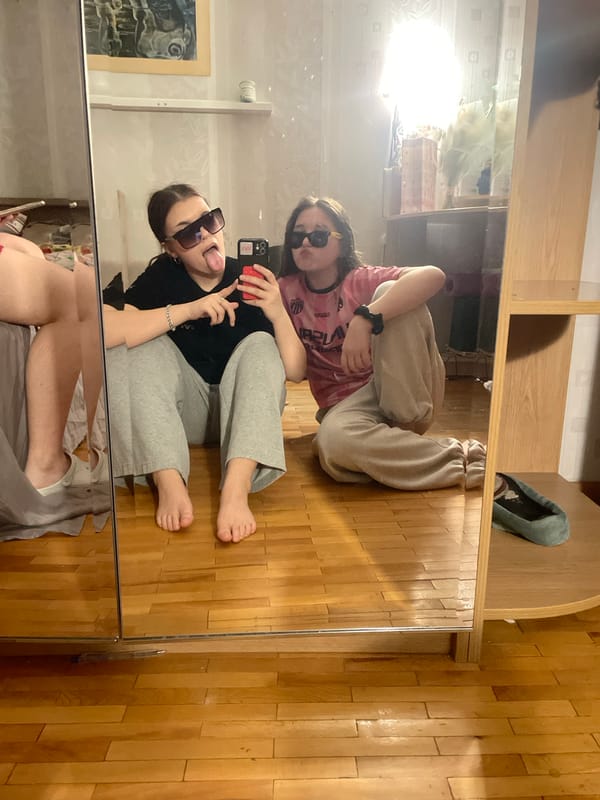 Young women pose playfully in Russian homes during evening