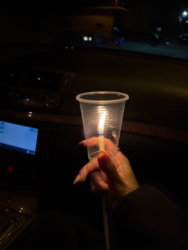 Person lights candle, match inside parked car in Bulgaria