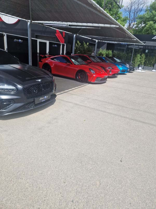 Cars parked under ApexOne-branded covered area