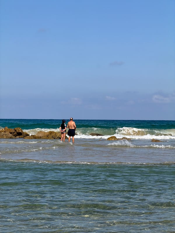 Bat Yam beach comes alive with surfers, paddlers, and beachgoers