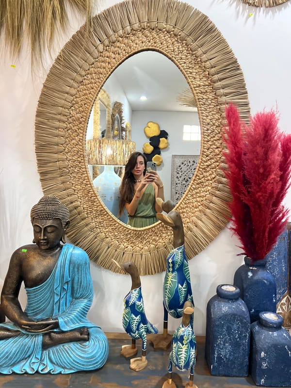 Woman takes mirror selfie, carnations spotted in early morning