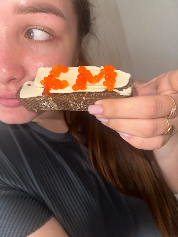 Woman enjoys caviar toast breakfast in Chaikovsky, Russia