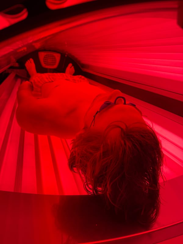Tanning bed session under red UV lights in Fife, WA