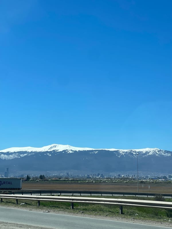 Snow-covered Vitosha Mountains viewed from highway near Sofia