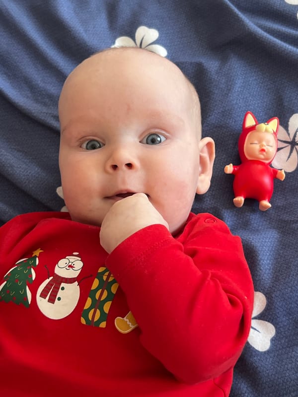 Baby in Christmas onesie photographed in Votkinsk, Russia