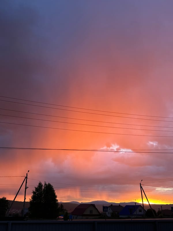 Witness documents vibrant sunset over rural landscape June 1st
