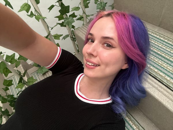 Woman takes colorful hair selfies in Zagreb mirror session
