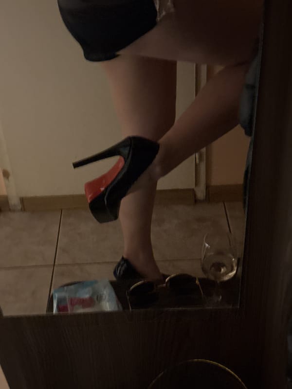 Person in designer heels photographed in Pleven bathroom