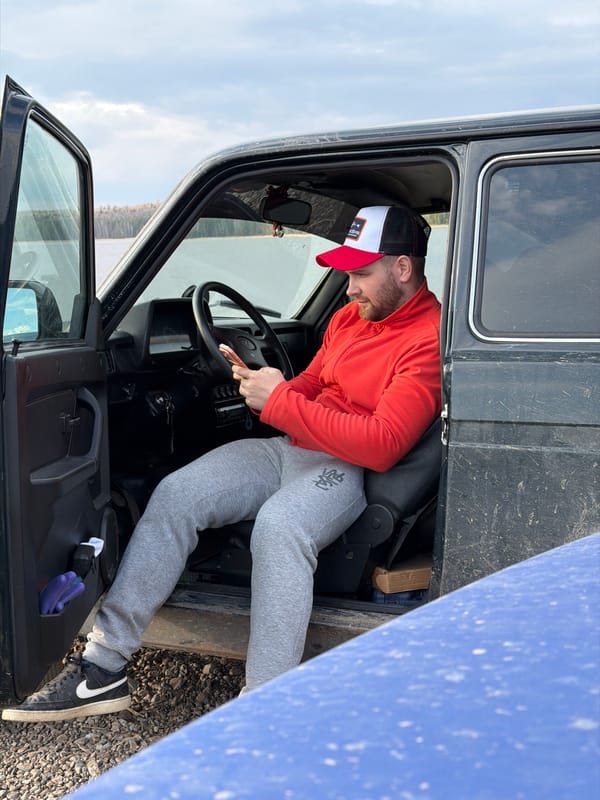 Casual moments captured in Chaikovsky: man in vehicle, fish in lake