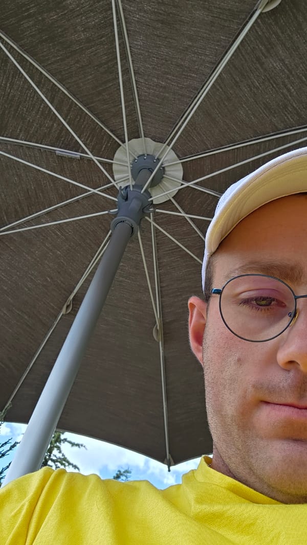 Low-angle umbrella shots frame a figure from below