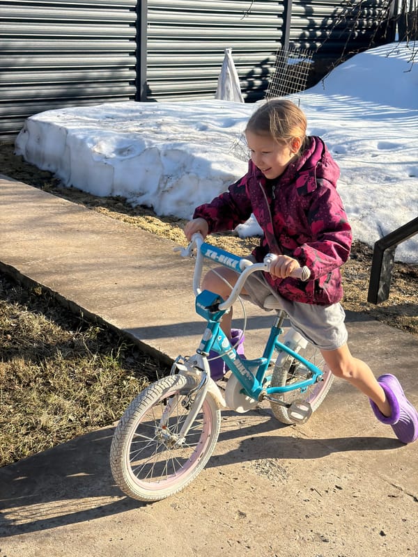 Child rides bicycle in Markovo, Russia