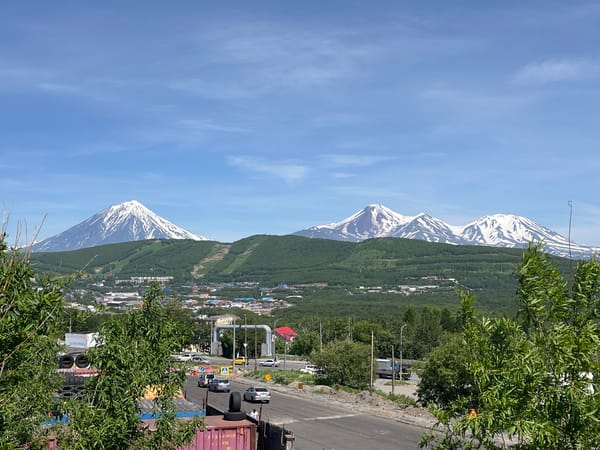 Petropavlovsk-Kamchatsky sits beneath snow-capped Kamchatka volcanoes