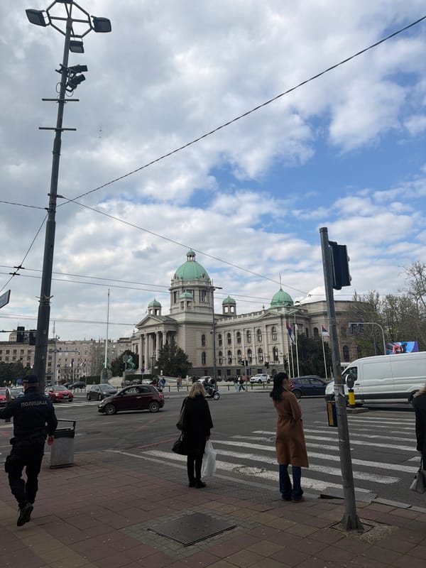 Everyday street scene captured near Serbian Parliament building