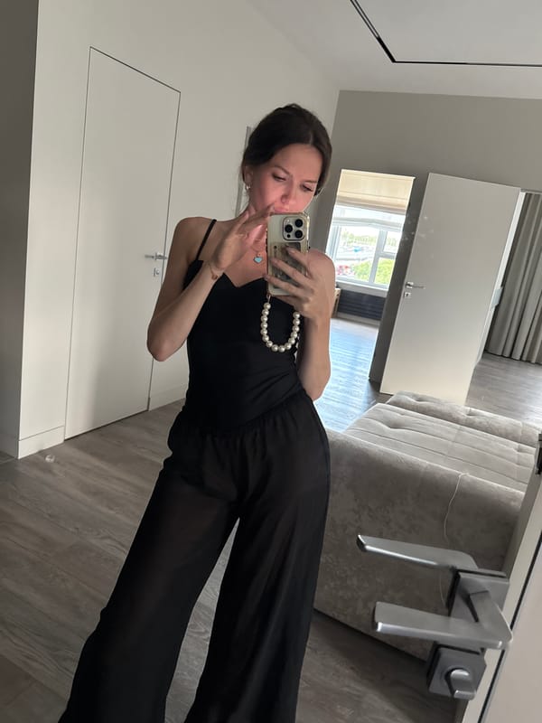 Woman takes mirror selfies in Dolgoprudny apartment