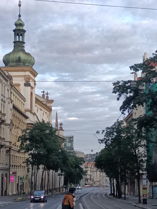 Walking a tram boulevard in central Prague on a cloudy day
