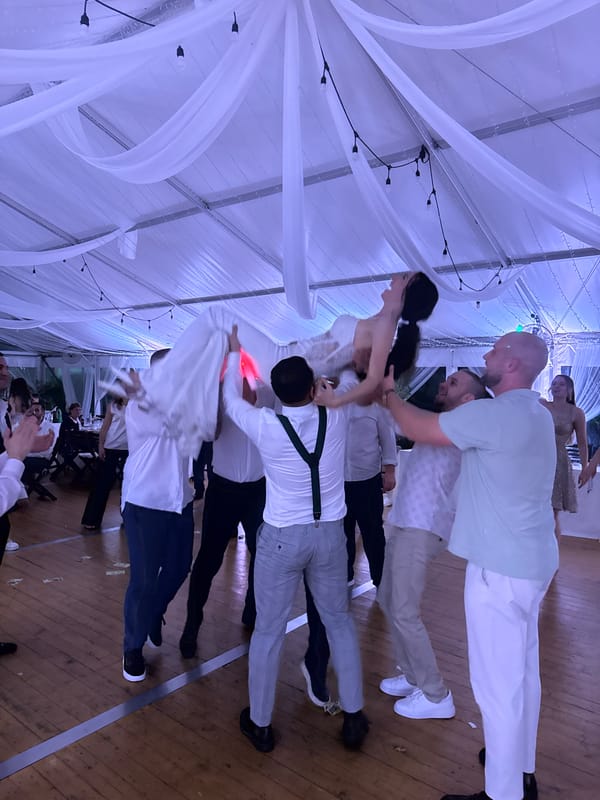 Wedding reception celebrates under tent in Perushtitsa, Bulgaria
