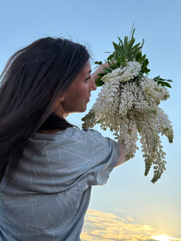 Summer afternoon in a Vassyata lupine field, bouquets in hand