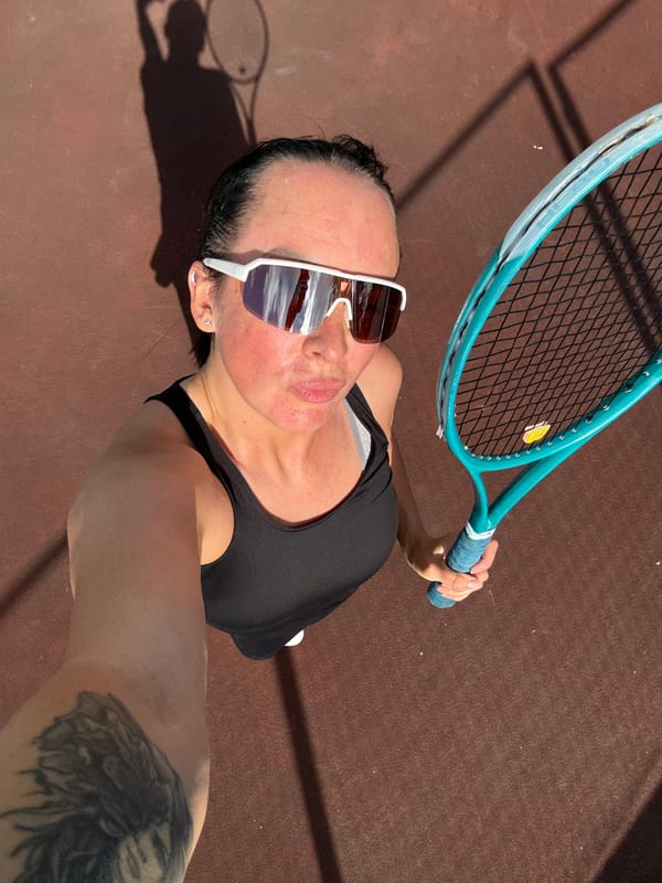 Afternoon tennis session at an outdoor court in Chaikovsky