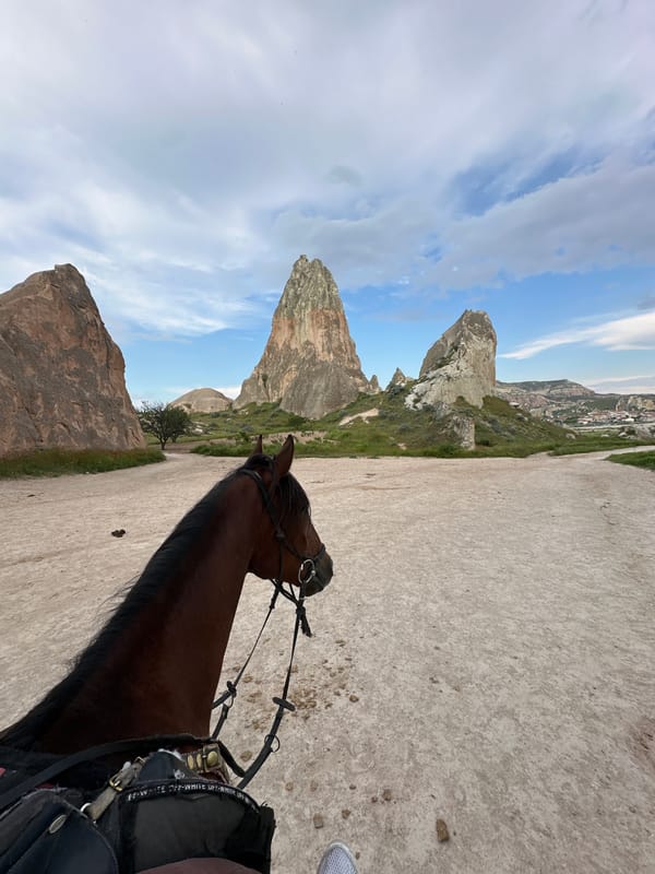 Horseback rider explores rural Avanos landscape in Turkey