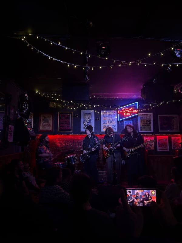 Three-piece band performs at intimate London music venue