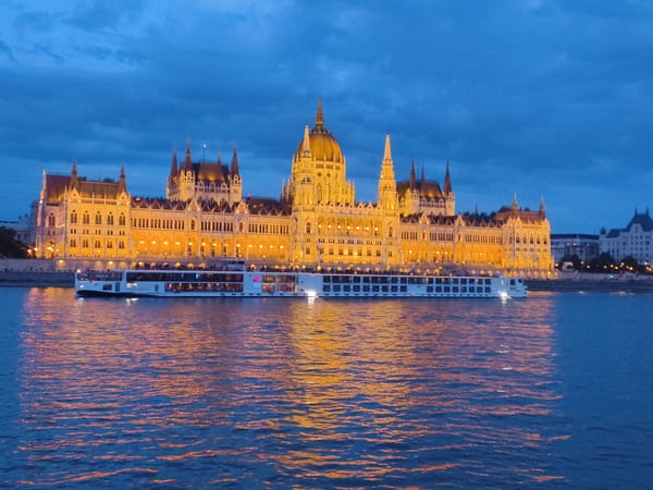 Evening documentation of illuminated Hungarian Parliament from Danube River