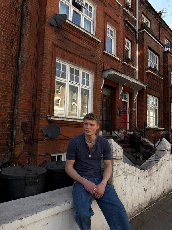 Shirtless man photographed waving in London park