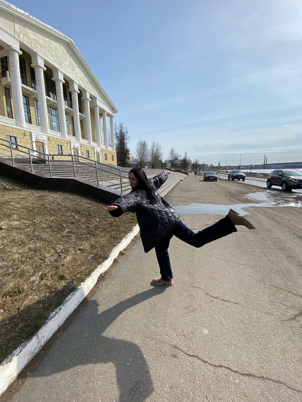 Woman photographs herself at cultural sites in Votkinsk, Russia